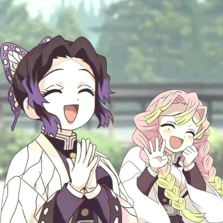Two smiling anime characters with butterfly and pink-and-green hair details, sharing a joyful moment