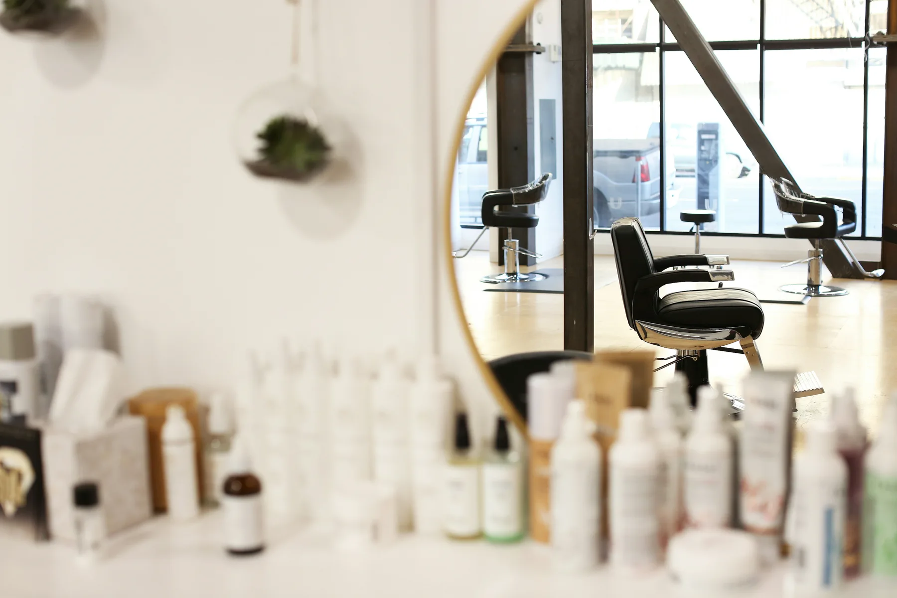A sunlit salon reflected in a mirror