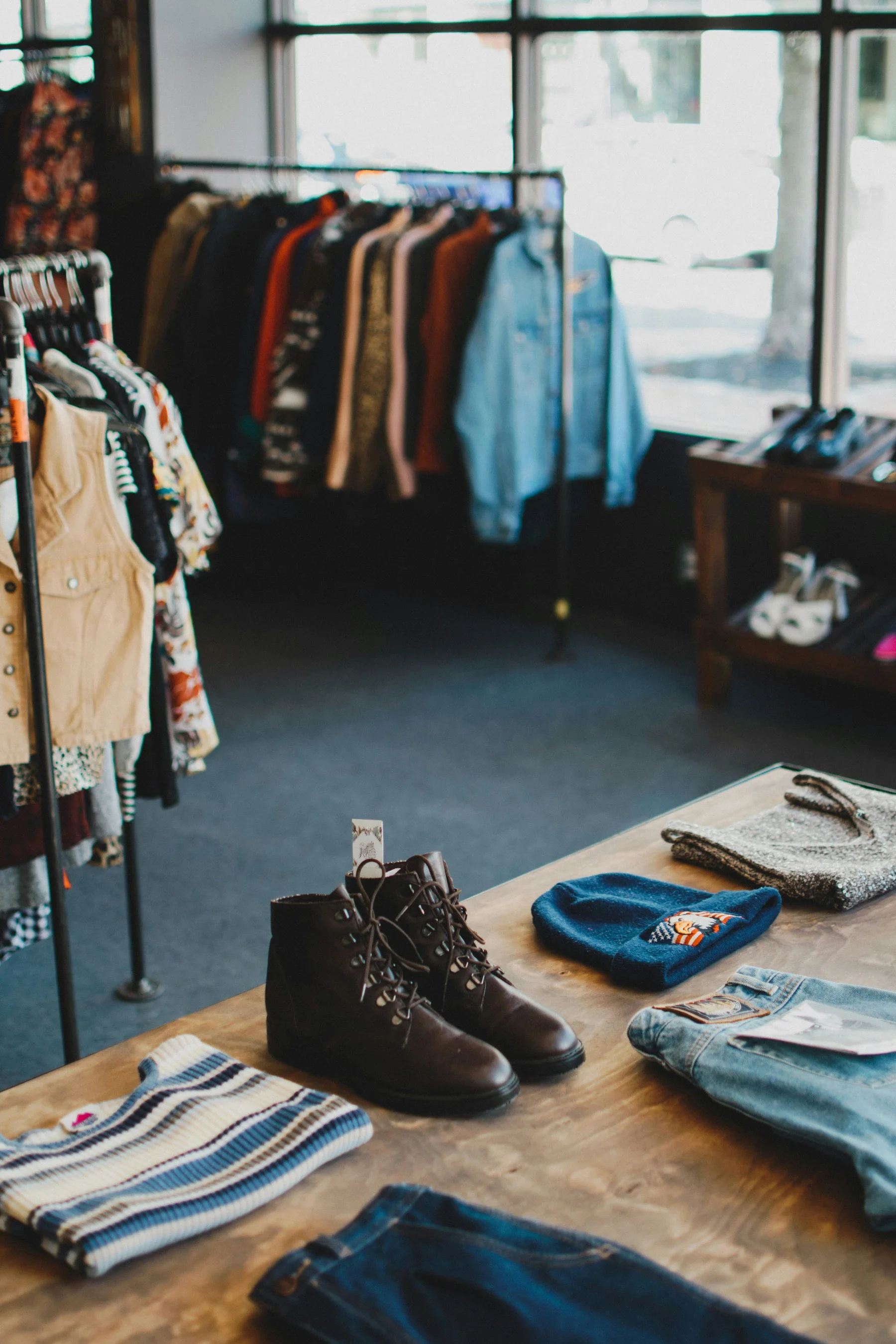 Vintage clothing and boots displayed in a secondhand store