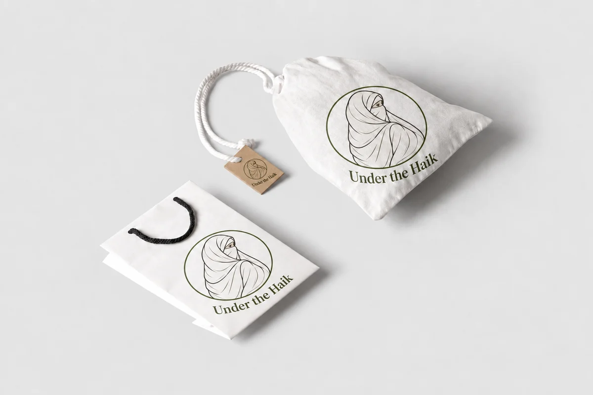 Under the Haik branding on a drawstring pouch, paper shopping bag and kraft gift tag